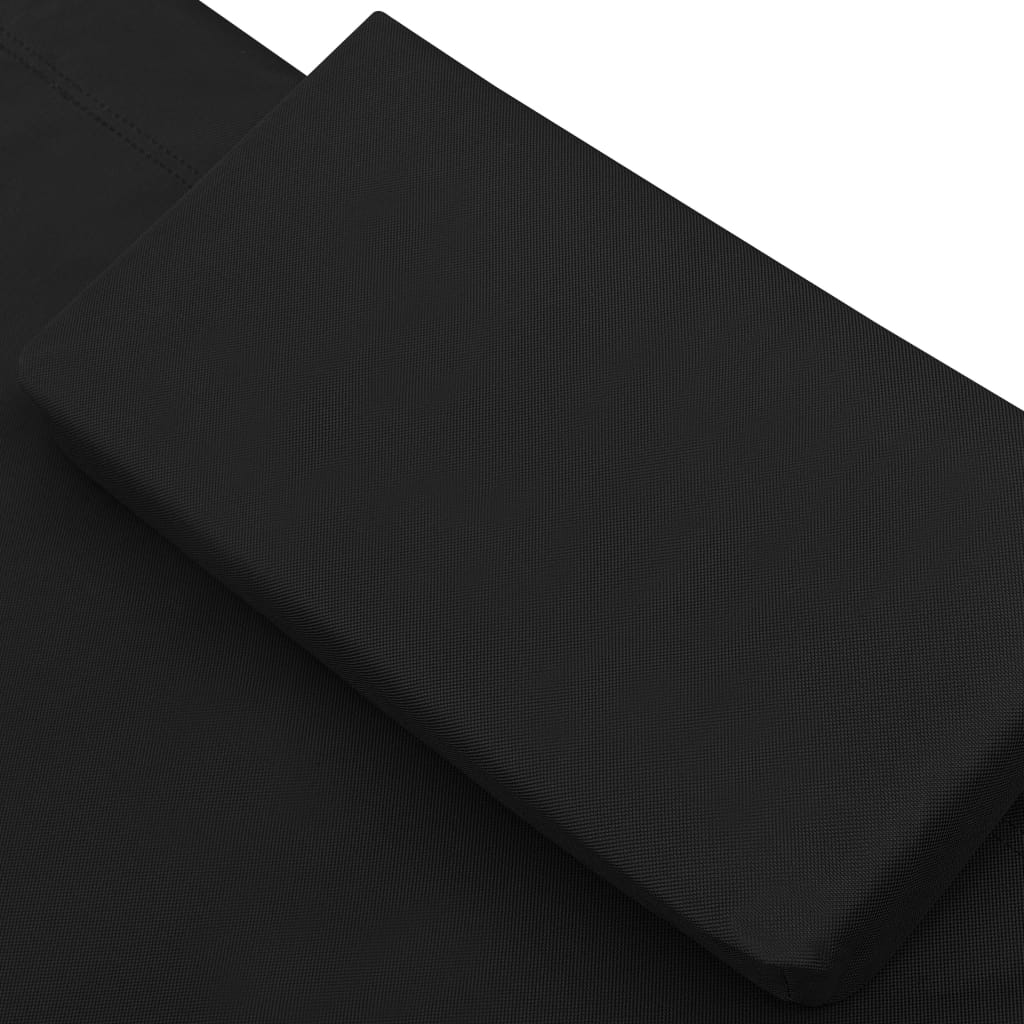 Sun lounger with canopy and black cushion