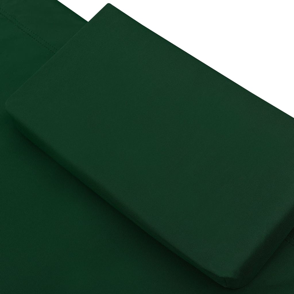 Sun lounger with canopy and green cushion