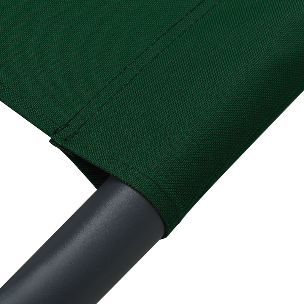 Sun lounger with canopy and green cushion