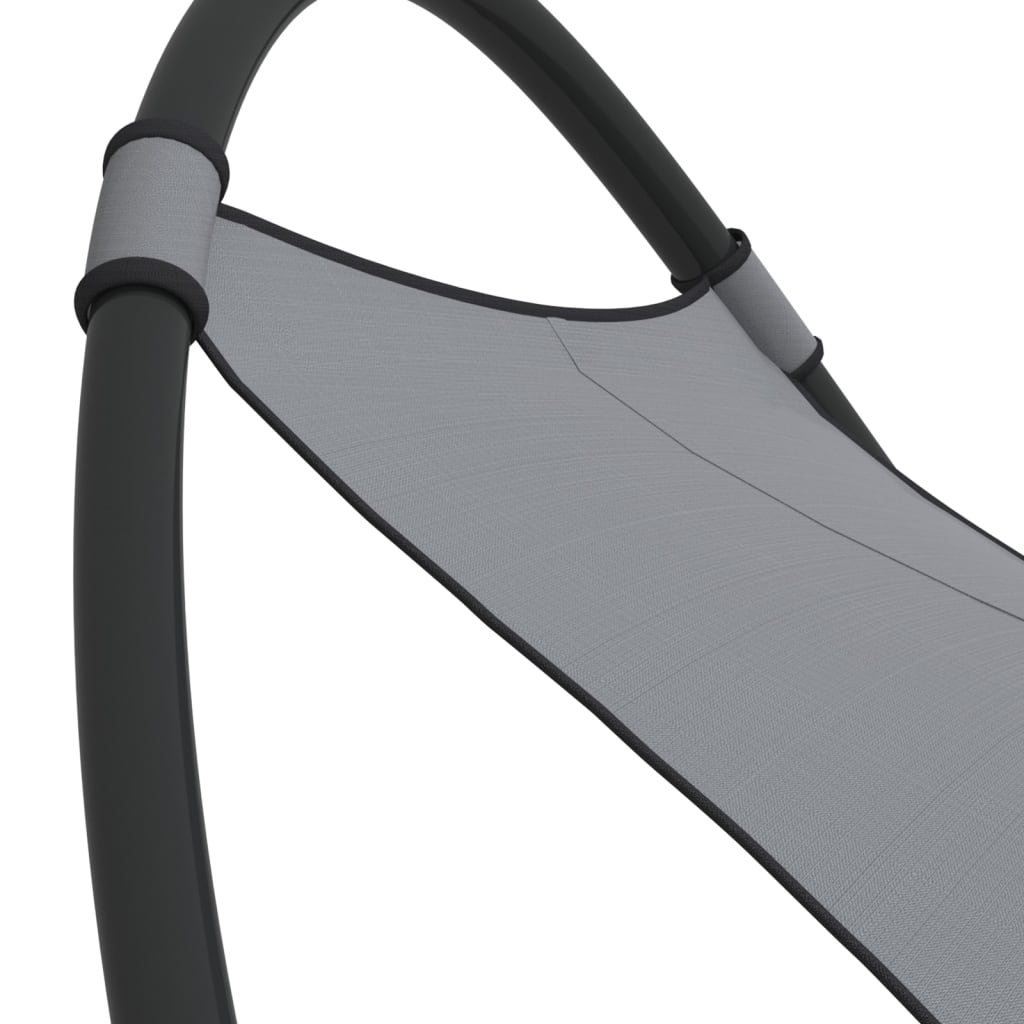 Rocking sun lounger with steel and grey textilene wheels