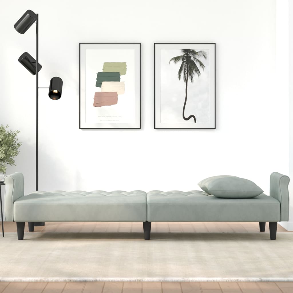 Light grey velvet sofa bed with armrests