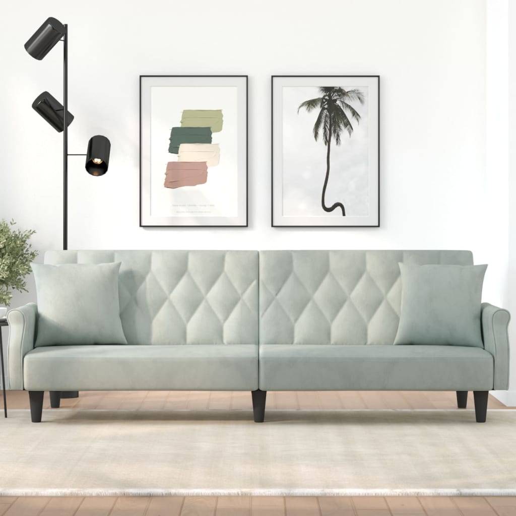 Light grey velvet sofa bed with armrests