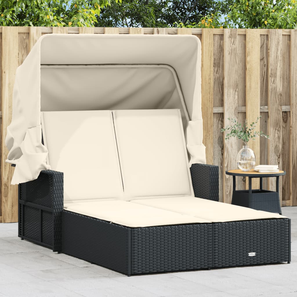 Double sun lounger with canopy and cushions in black poly rattan