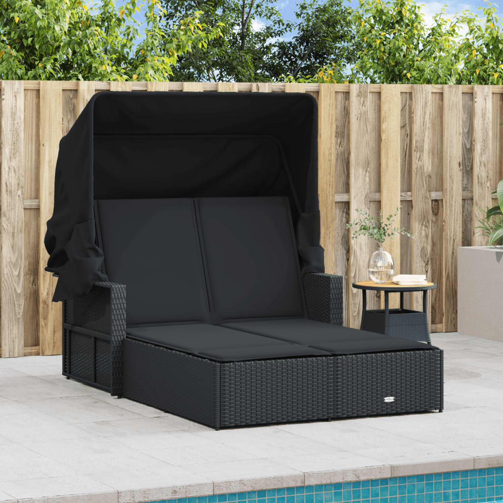 Double sun lounger with canopy and cushions in black poly rattan
