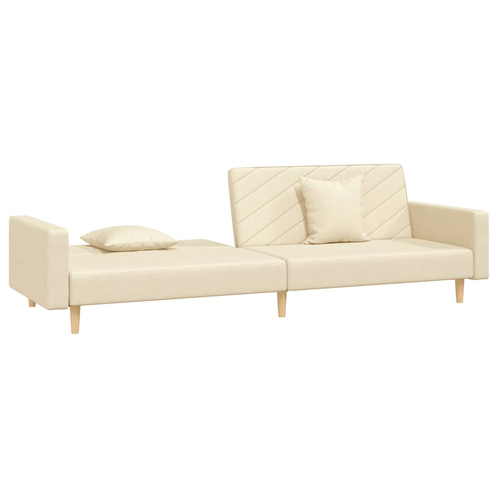 2-seater sofa bed with two cushions in cream-colored fabric