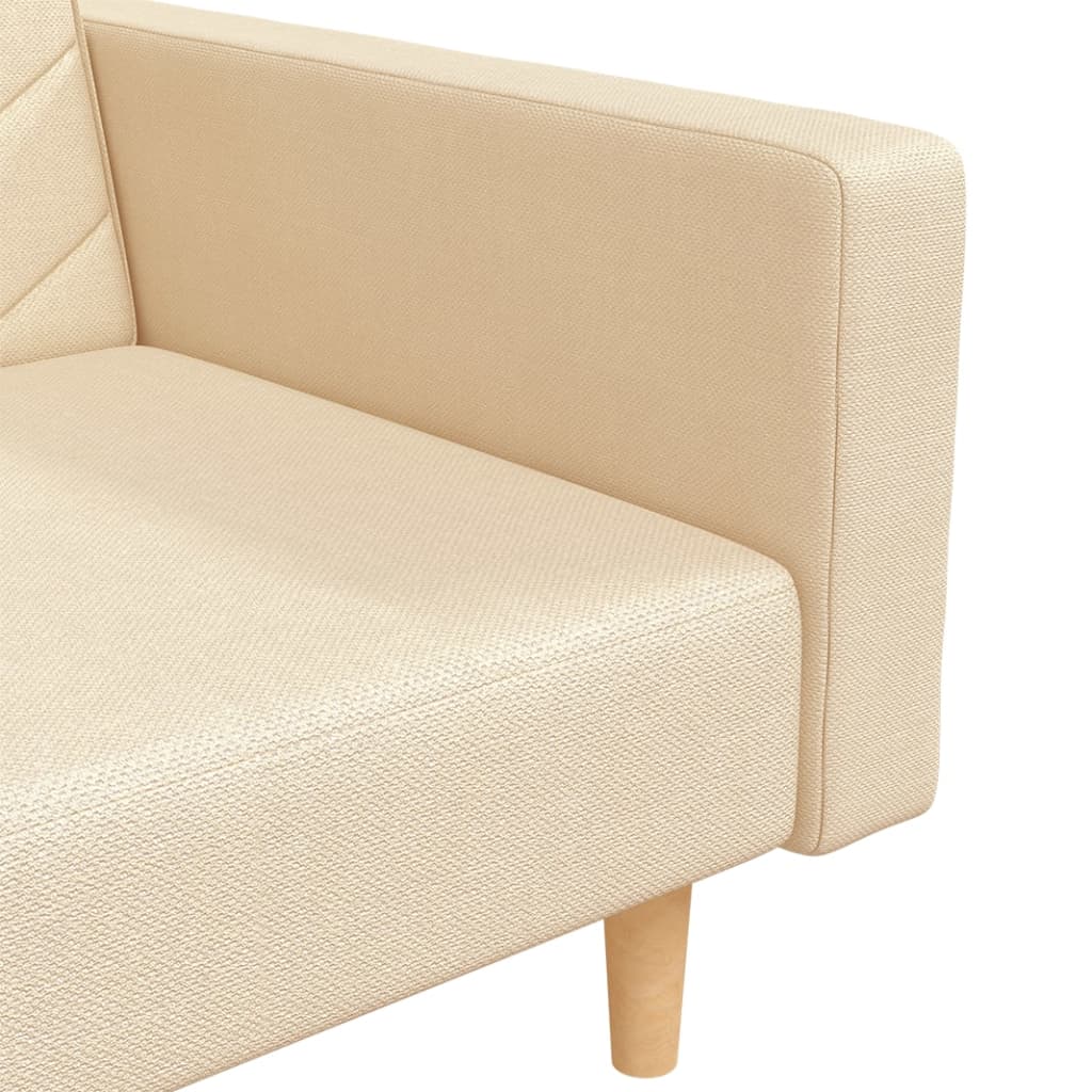 2-seater sofa bed with two cushions in cream-colored fabric
