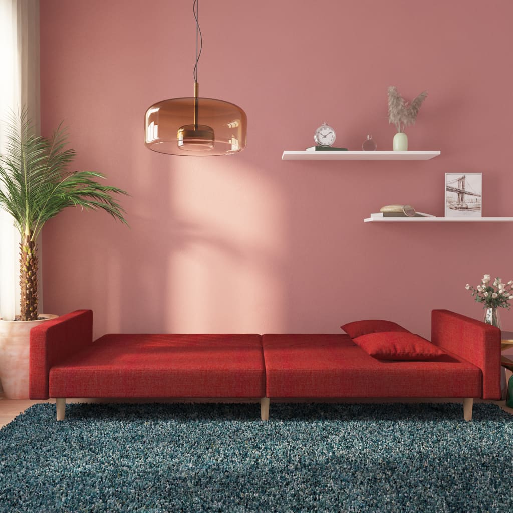 2-seater sofa bed with two cushions in red fabric