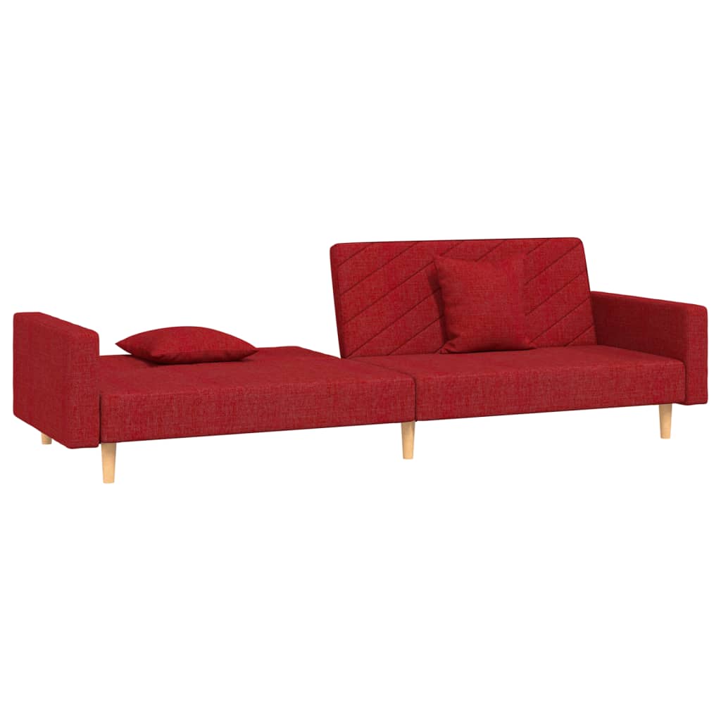 2-seater sofa bed with two cushions in red fabric