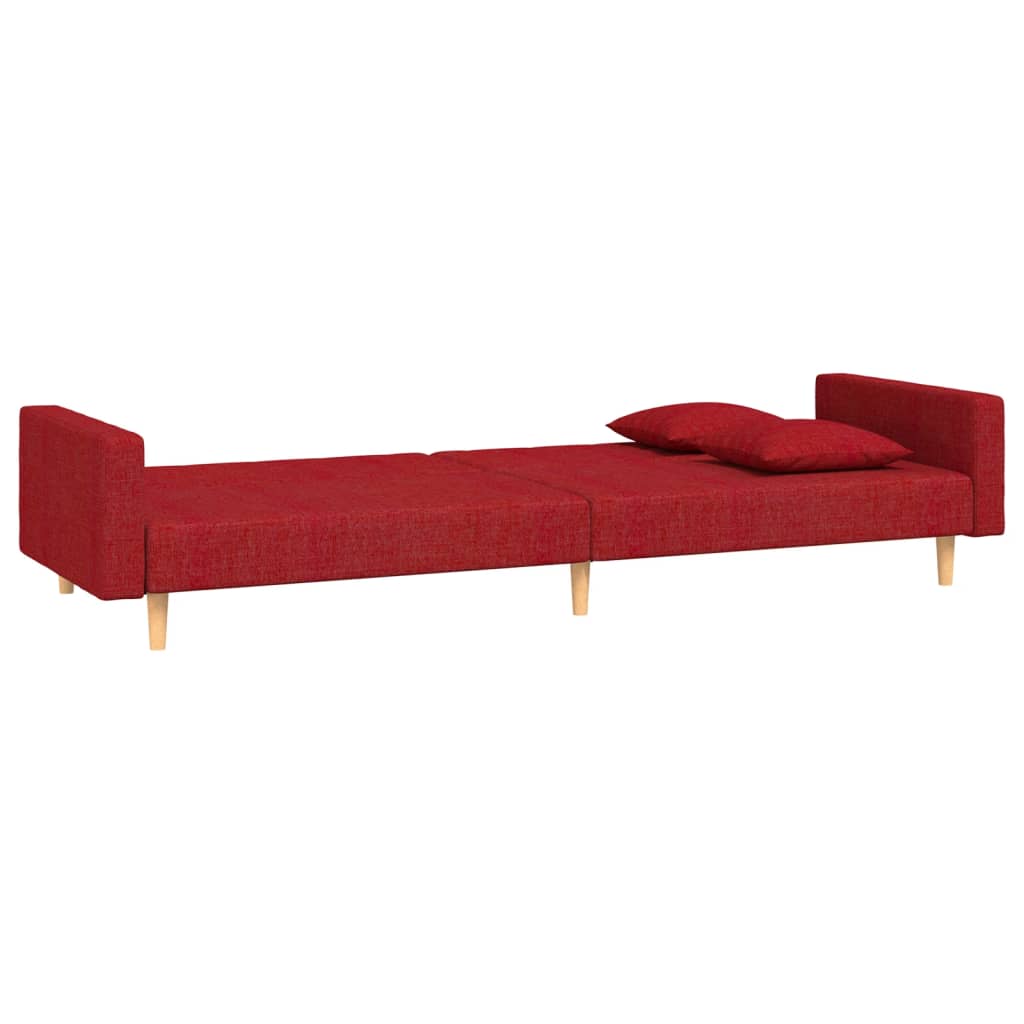 2-seater sofa bed with two cushions in red fabric