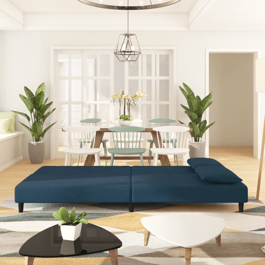 2-seater sofa bed with two blue velvet cushions