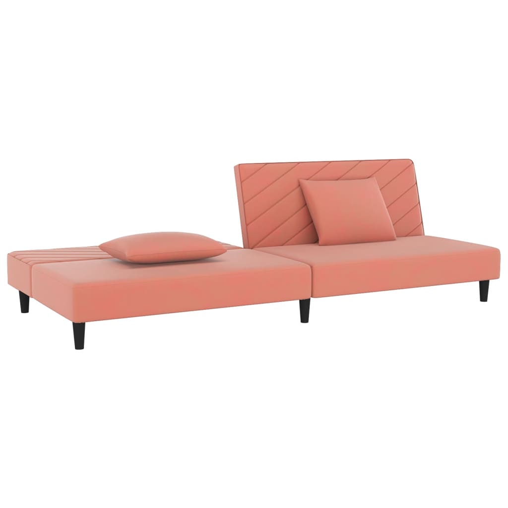 2-seater sofa bed with two pink velvet cushions