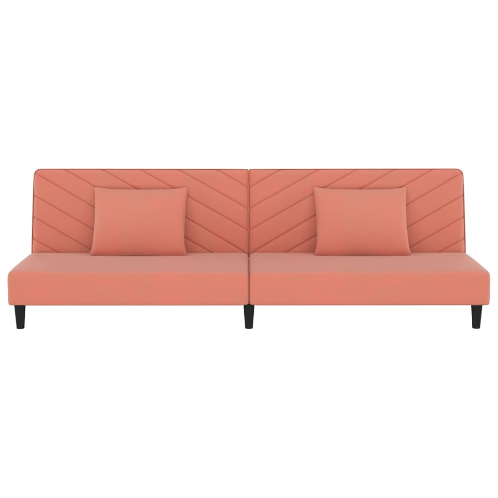 2-seater sofa bed with two pink velvet cushions
