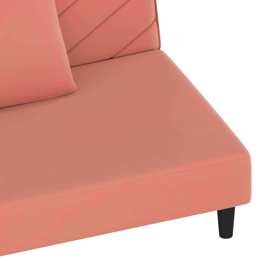 2-seater sofa bed with two pink velvet cushions