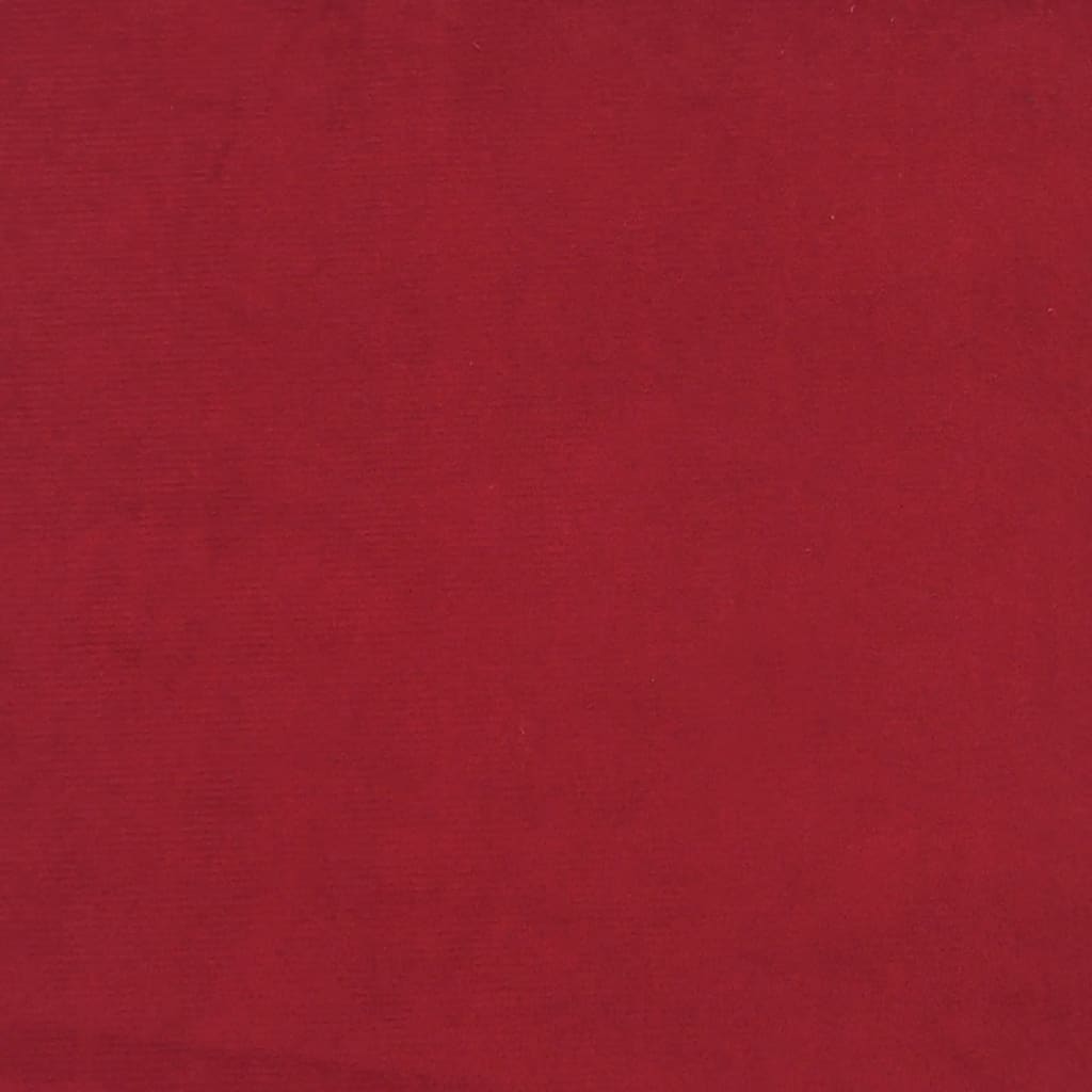 2-seater sofa bed with two red velvet cushions