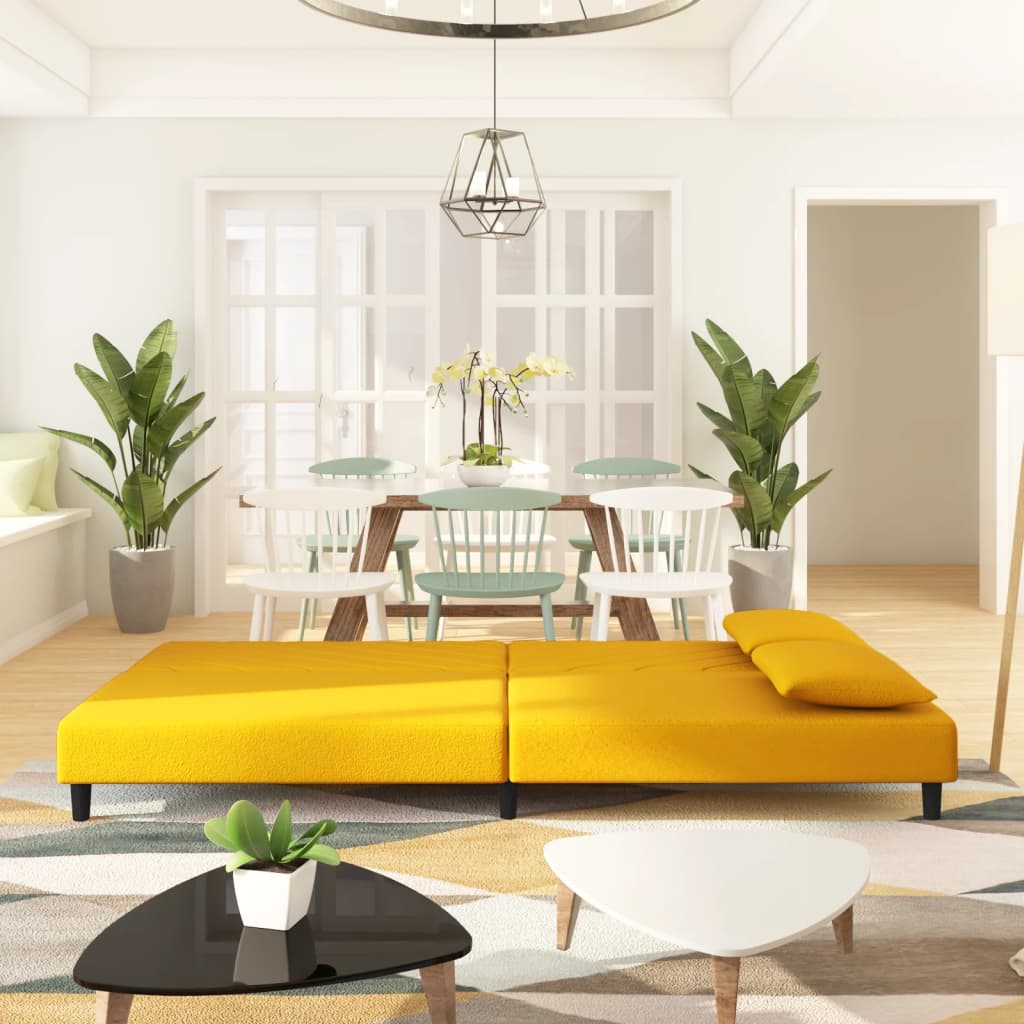 2-seater sofa bed with two yellow velvet cushions