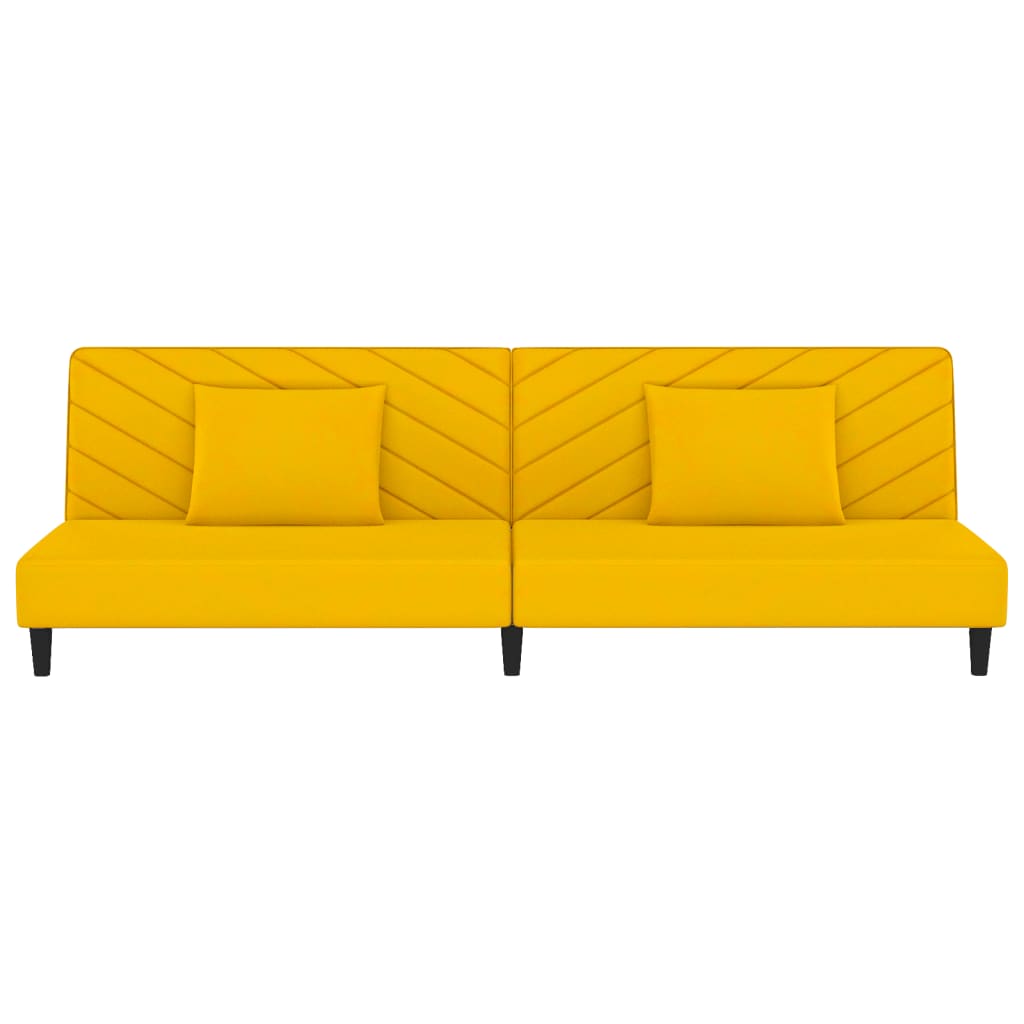 2-seater sofa bed with two yellow velvet cushions