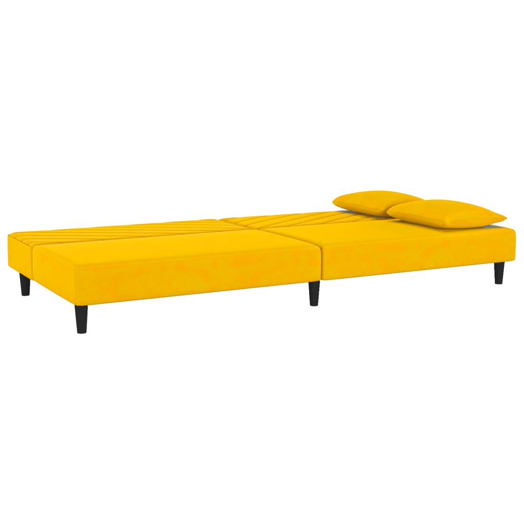 2-seater sofa bed with two yellow velvet cushions