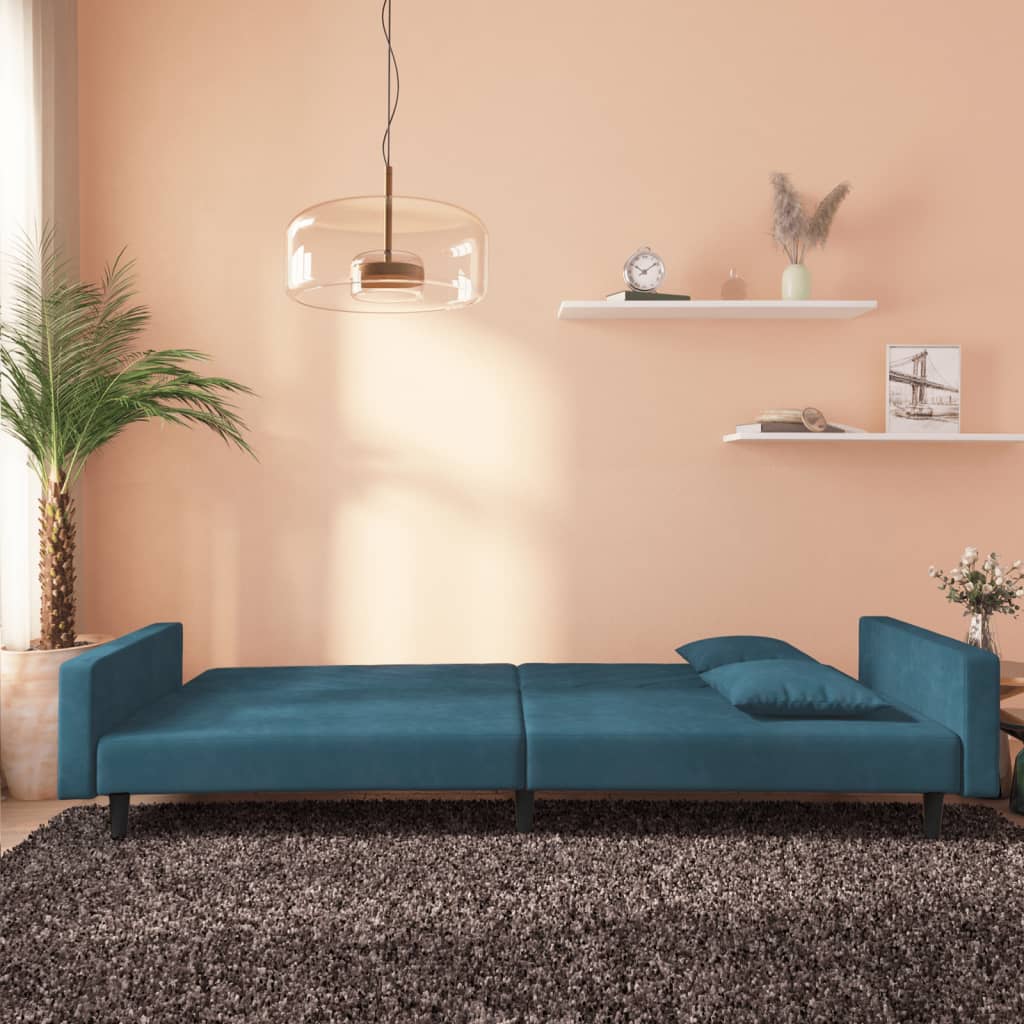 2-seater sofa bed with two blue velvet cushions