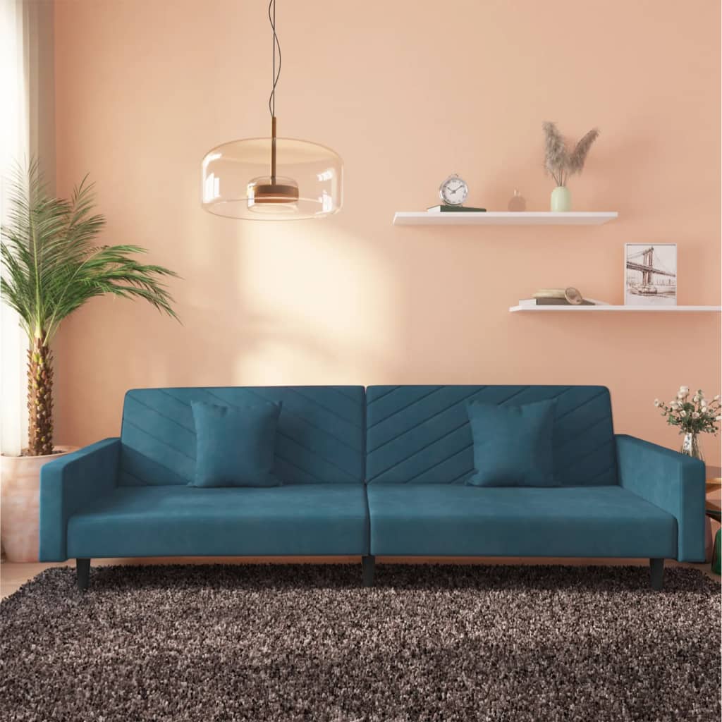 2-seater sofa bed with two blue velvet cushions