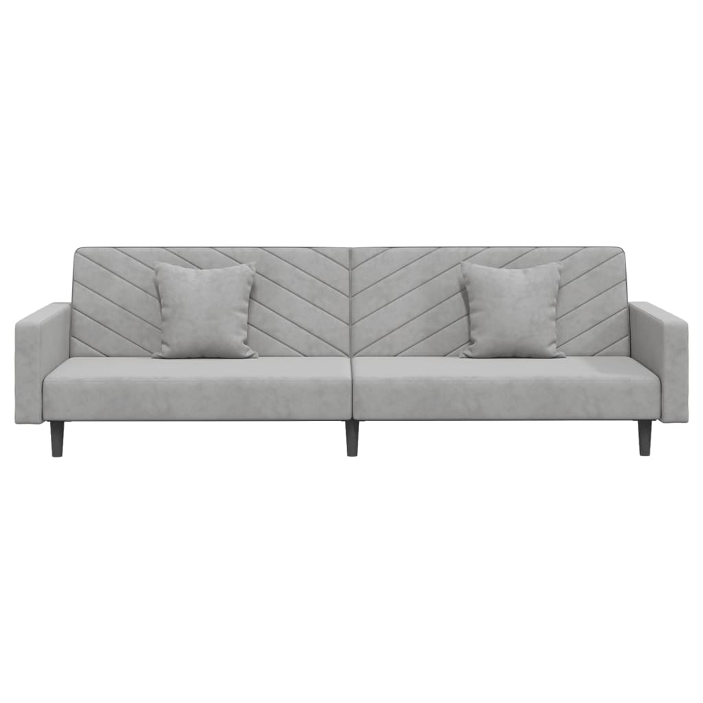 2-seater sofa bed with two light grey velvet cushions