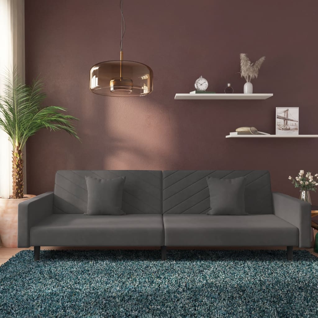 2-seater sofa bed with two dark grey velvet cushions