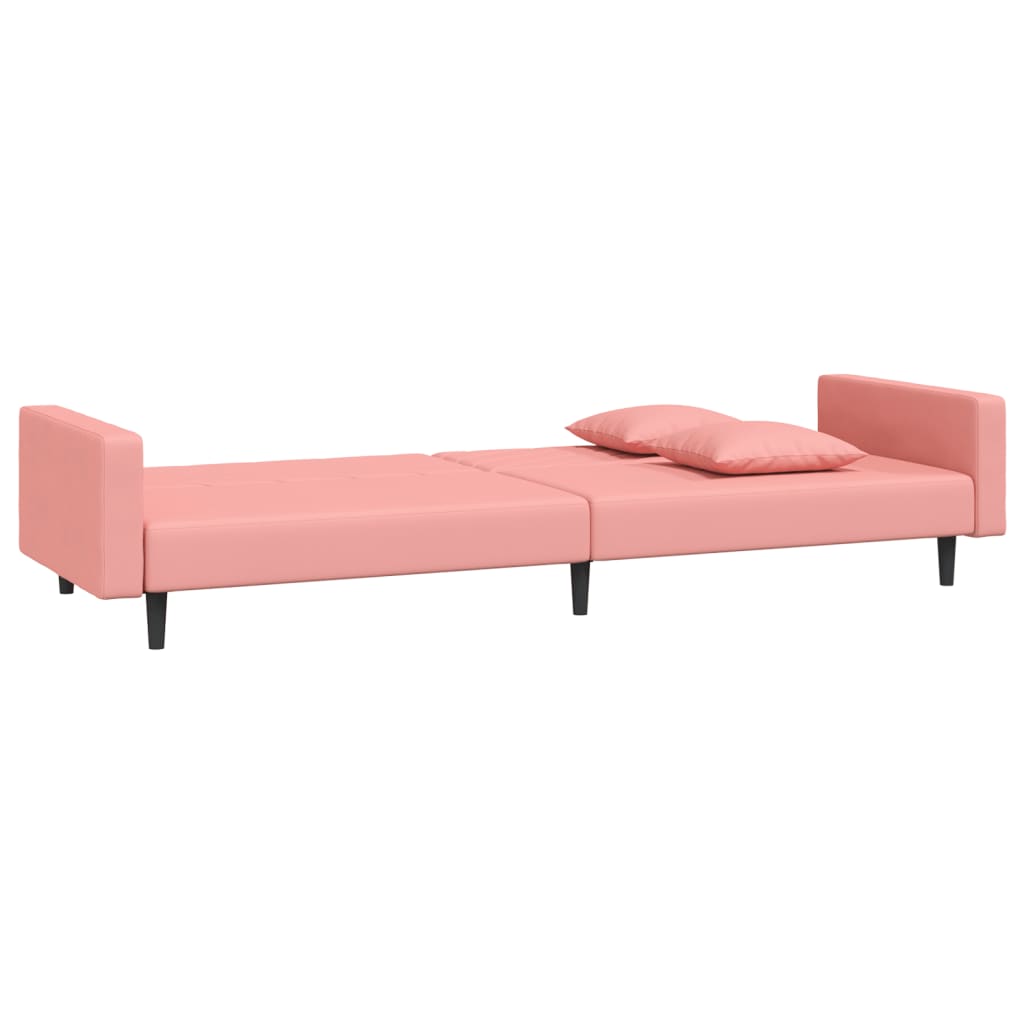 2-seater sofa bed with two pink velvet cushions