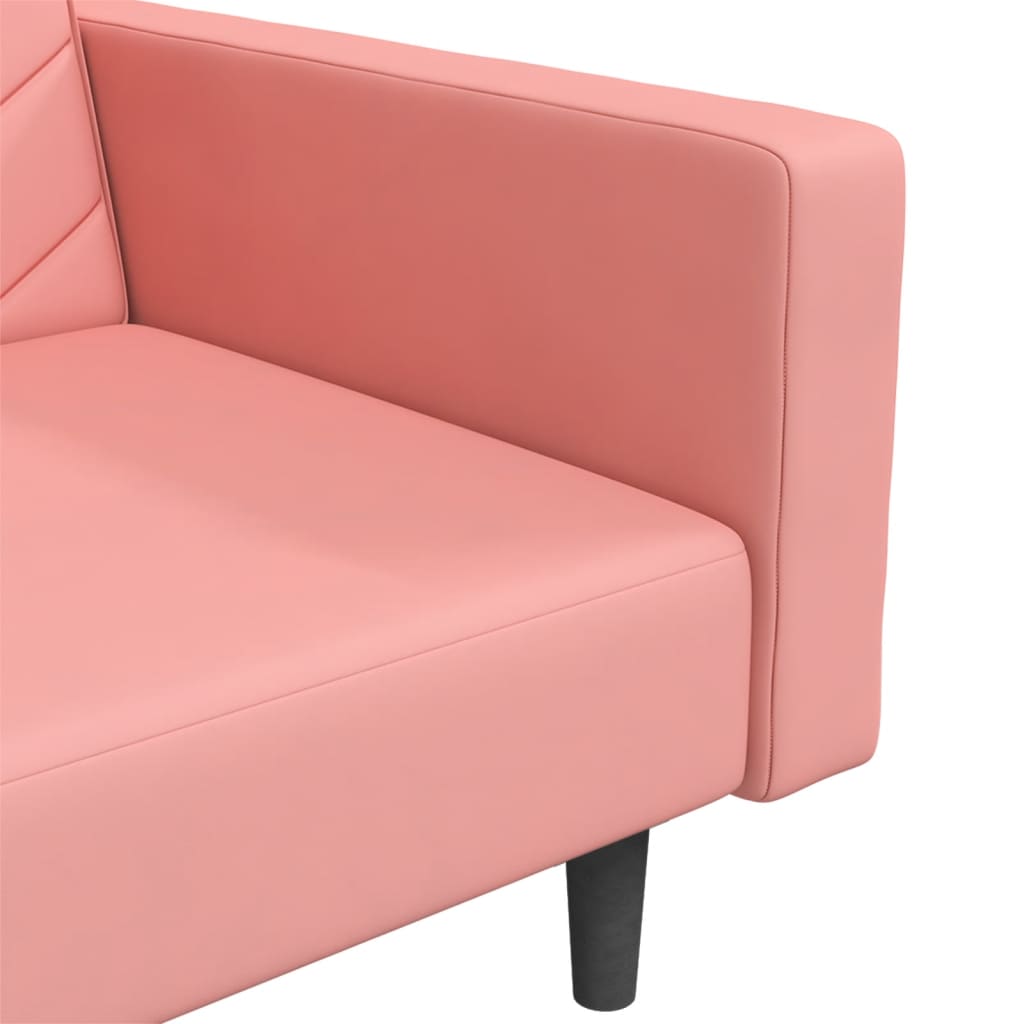 2-seater sofa bed with two pink velvet cushions