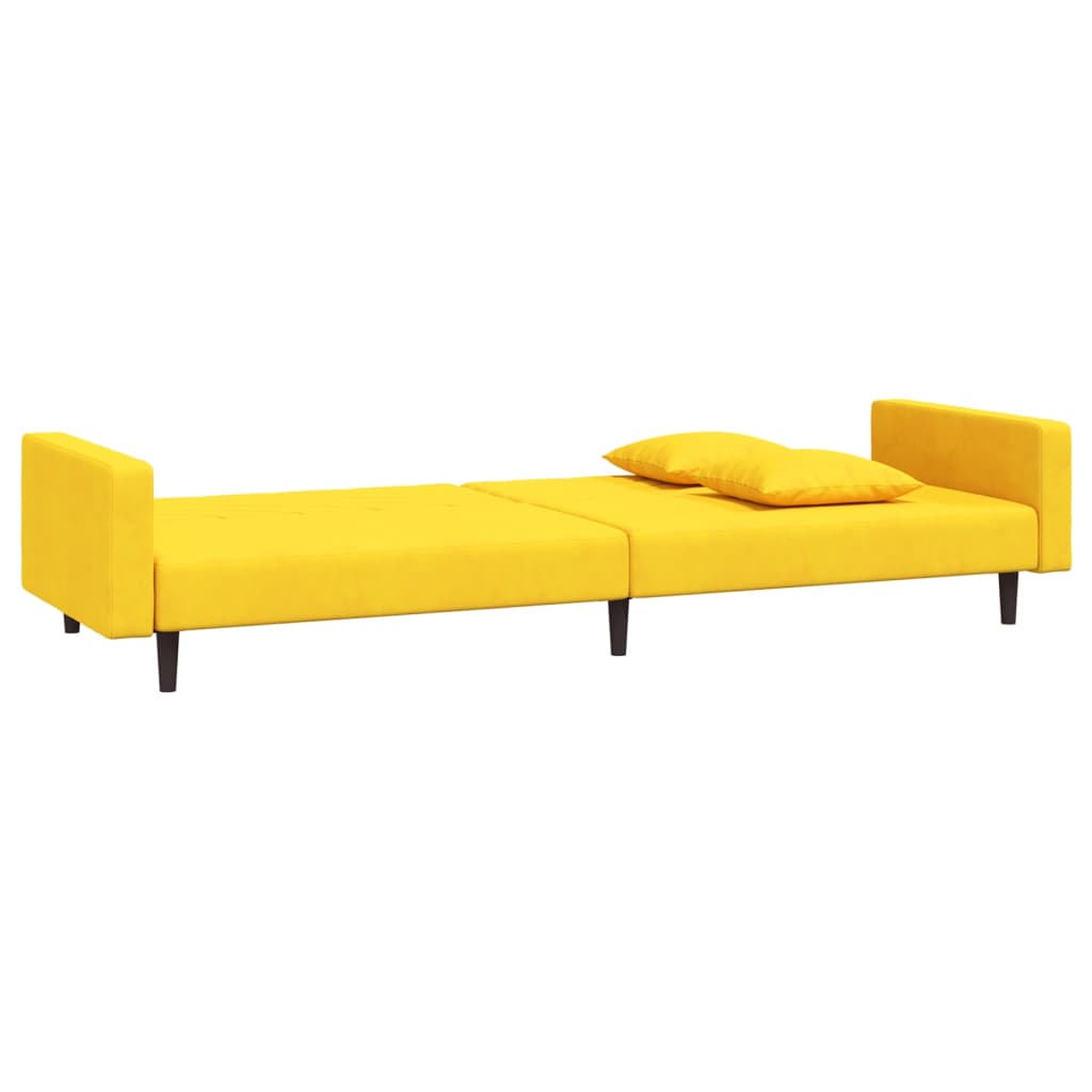 2-seater sofa bed with two yellow velvet cushions