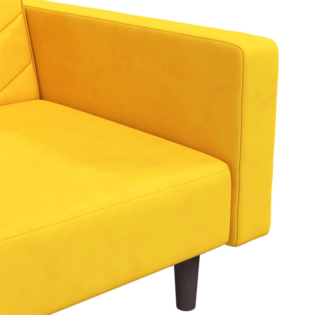 2-seater sofa bed with two yellow velvet cushions