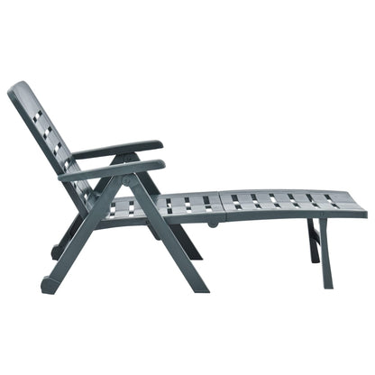 Green plastic folding sun lounger