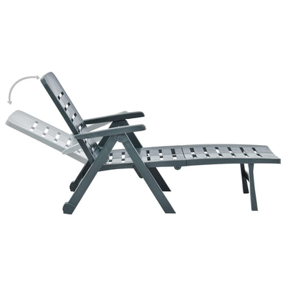 Green plastic folding sun lounger