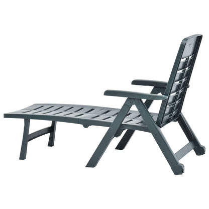 Green plastic folding sun lounger