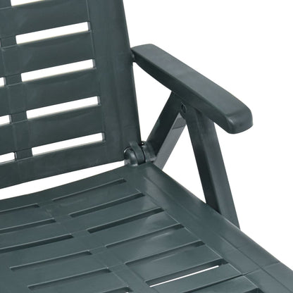 Green plastic folding sun lounger