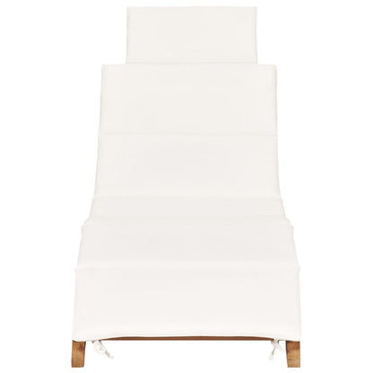 Folding sun lounger with cream-colored cushion in solid teak