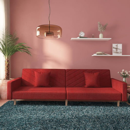 2-seater sofa bed with two cushions in red fabric
