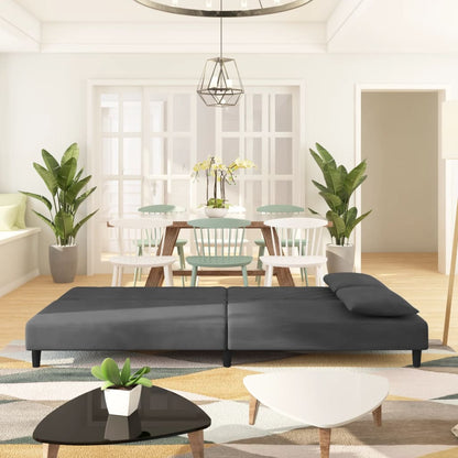 2-seater sofa bed with two dark grey velvet cushions