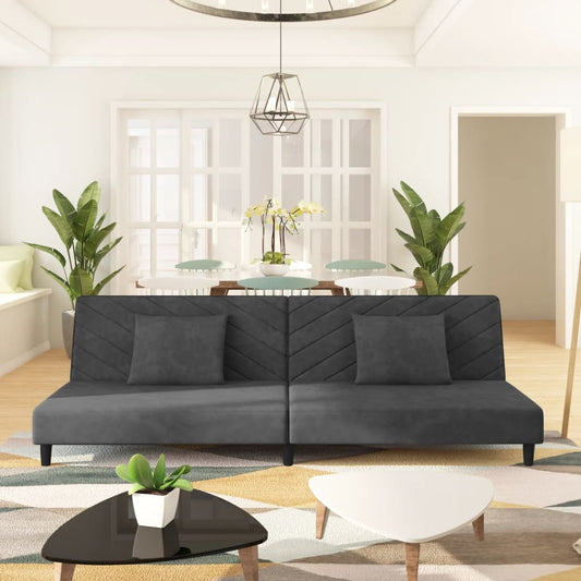 2-seater sofa bed with two dark grey velvet cushions
