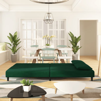 2-seater sofa bed with two dark green velvet cushions