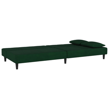 2-seater sofa bed with two dark green velvet cushions