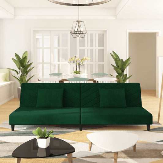 2-seater sofa bed with two dark green velvet cushions