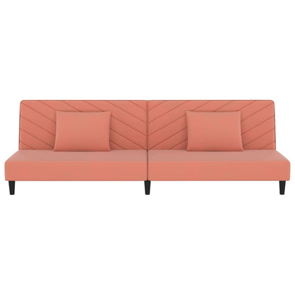 2-seater sofa bed with two pink velvet cushions