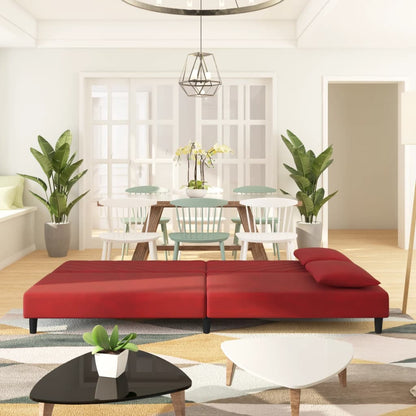 2-seater sofa bed with two red velvet cushions