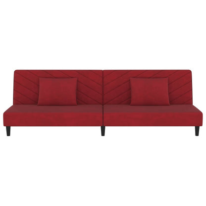 2-seater sofa bed with two red velvet cushions