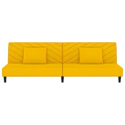 2-seater sofa bed with two yellow velvet cushions