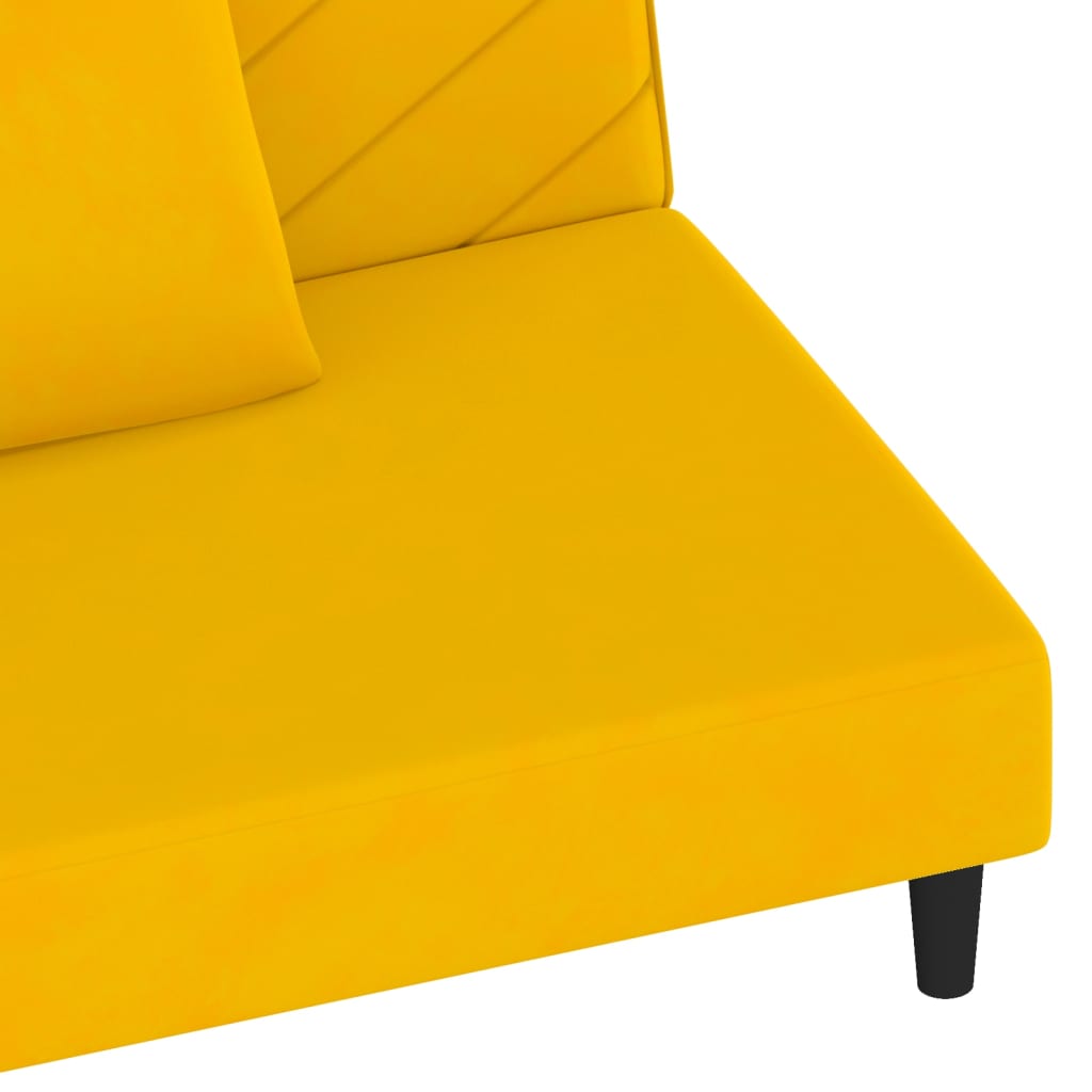 2-seater sofa bed with two yellow velvet cushions