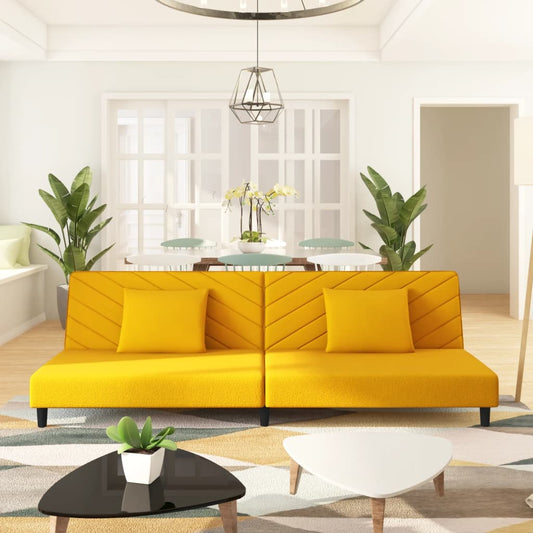 2-seater sofa bed with two yellow velvet cushions