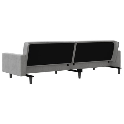 2-seater sofa bed with two light grey velvet cushions