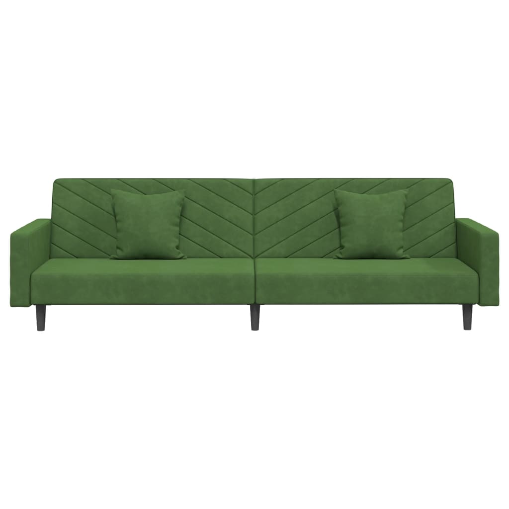 2-seater sofa bed with two dark green velvet cushions