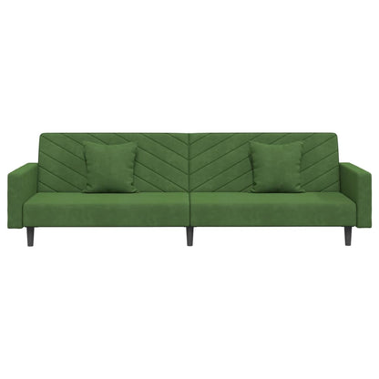2-seater sofa bed with two dark green velvet cushions