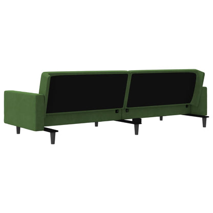 2-seater sofa bed with two dark green velvet cushions